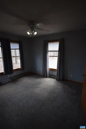 a view of empty room with windows