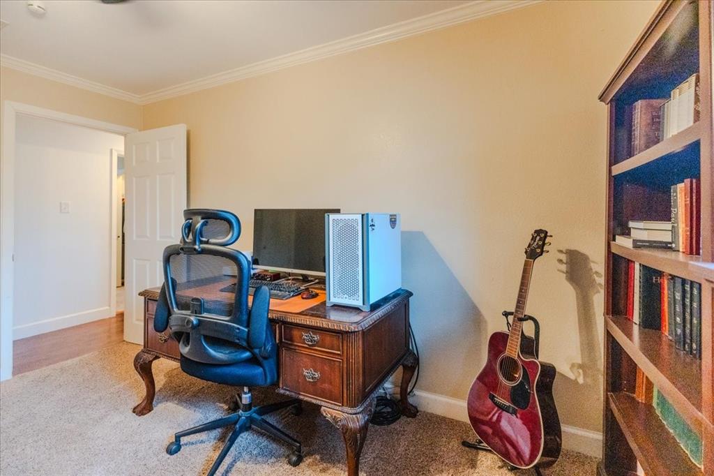 504 Bluebird Lane Red Oak, TX 75154 - Photo 22 of 28 a view of a workspace with furniture and a window