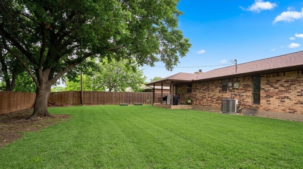504 Bluebird Lane Red Oak, TX 75154 - Photo 23 of 28 a view of a house with a yard and tree