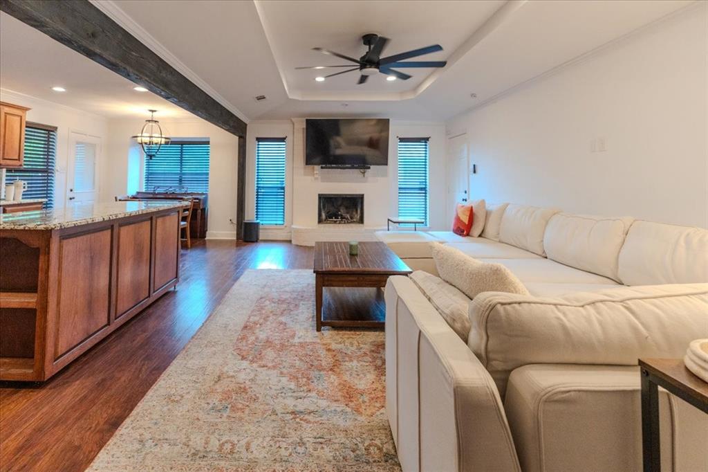 504 Bluebird Lane Red Oak, TX 75154 - Photo 8 of 28 a living room with furniture a fireplace and a flat screen tv