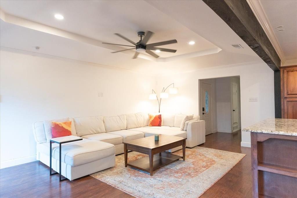 504 Bluebird Lane Red Oak, TX 75154 - Photo 9 of 28 a living room with furniture and a chandelier