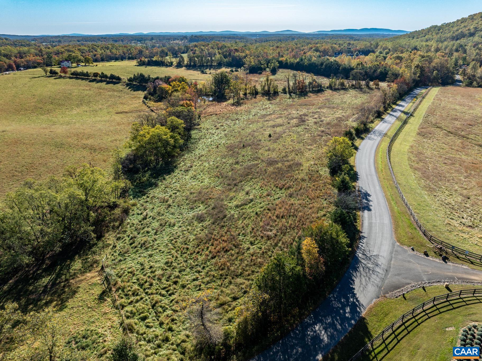 0 Octonia Road Stanardsville, VA 22973 - Photo 4 of 45 a view of a lake with houses in the back