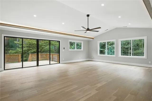 a view of an empty room with a sliding door