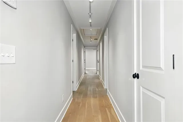 a view of a hallway with a white walls