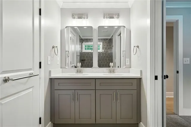 a bathroom with a double vanity sink and a mirror