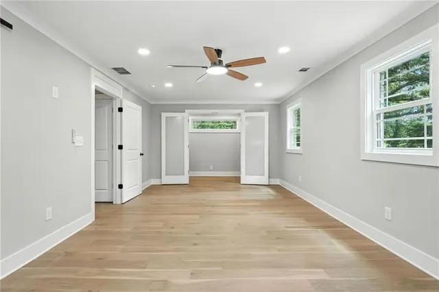 a view of an empty room with a window