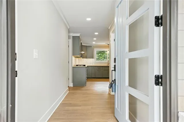 a view of a kitchen from the hallway