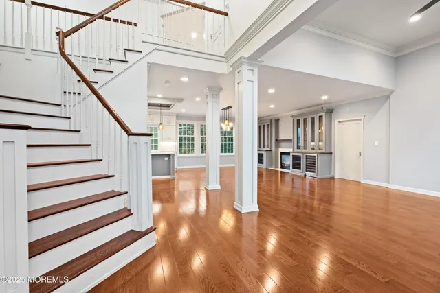a view of staircase with white walls and windows