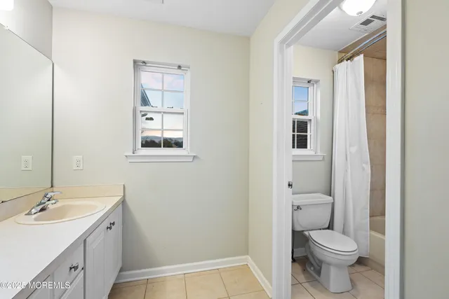 a kitchen with stainless steel appliances a refrigerator sink and stove top oven