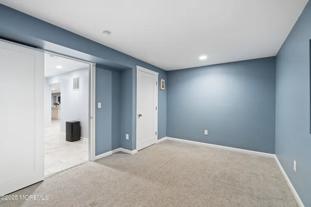 an aerial view of a house with garden space and street view