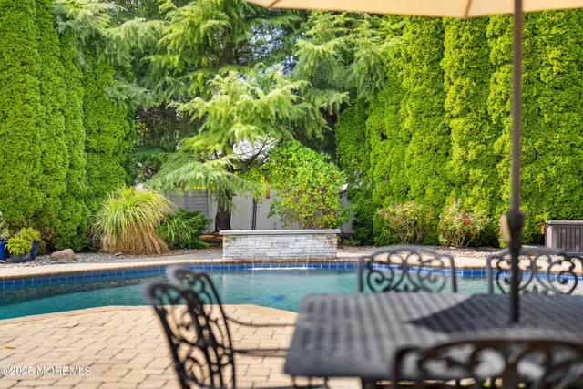 a view of a swimming pool with a patio
