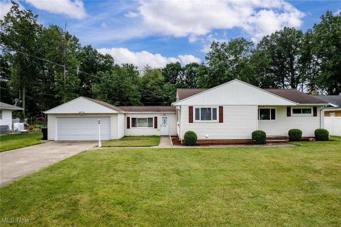 29776 Arthur Road Wickliffe, OH 44092 - Photo 49 of 49 Ranch-style home featuring concrete driveway, a garage, and roof with shingles