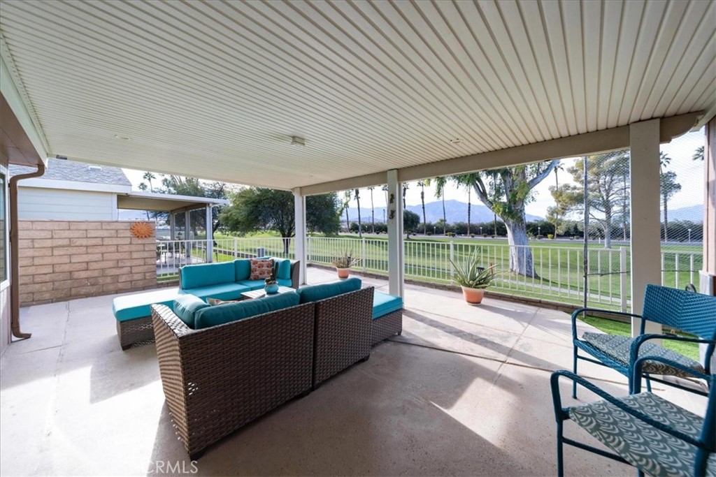 35493 Sand Rock Road Thousand Palms, CA 92276 - Photo 31 of 71 a view of a patio with a table and chairs