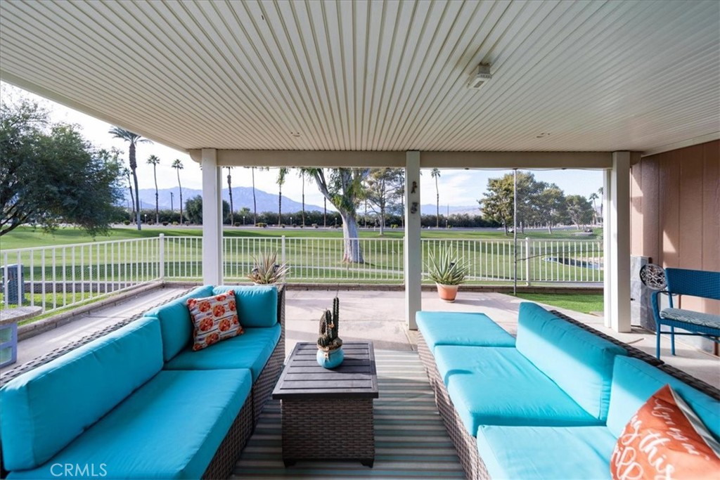 35493 Sand Rock Road Thousand Palms, CA 92276 - Photo 34 of 71 a view of a patio with swimming pool table and chairs