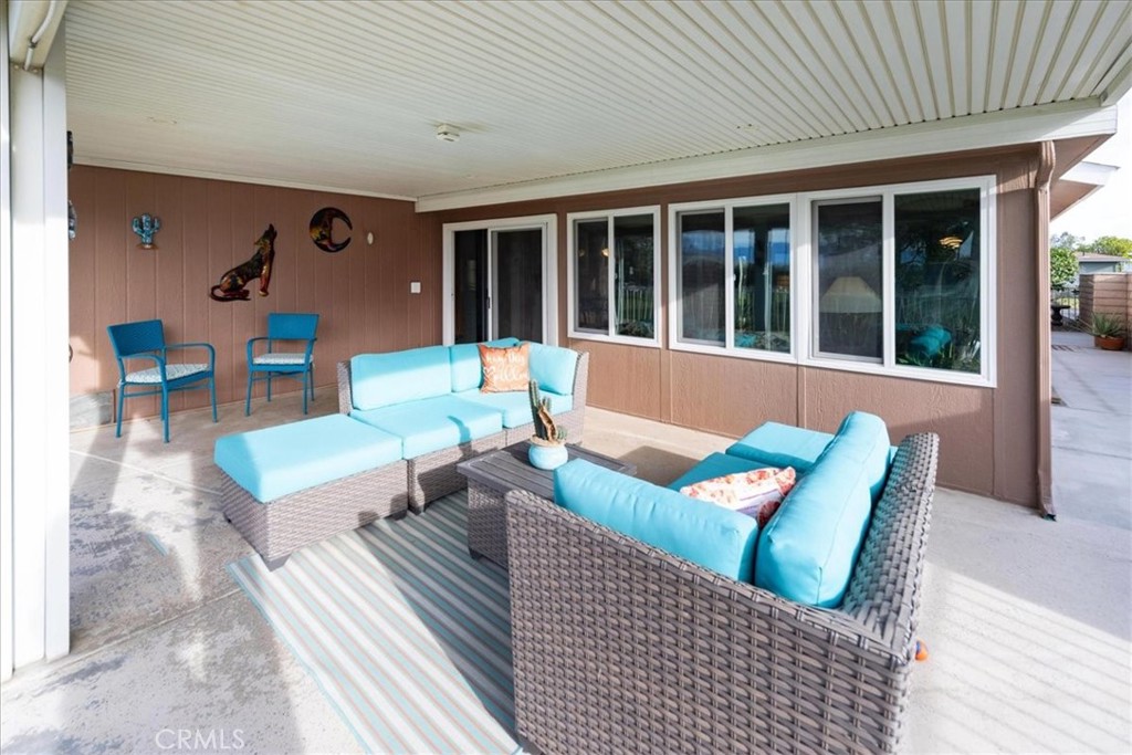 35493 Sand Rock Road Thousand Palms, CA 92276 - Photo 35 of 71 a living room with furniture and floor to ceiling window
