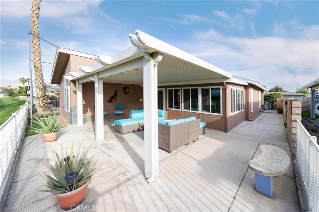 35493 Sand Rock Road Thousand Palms, CA 92276 - Photo 42 of 71 a view of a house with backyard porch and sitting area