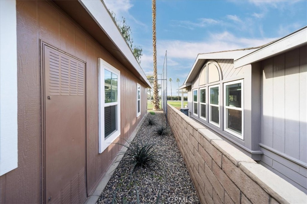 35493 Sand Rock Road Thousand Palms, CA 92276 - Photo 48 of 71 a view of a house with wooden floor and stairs