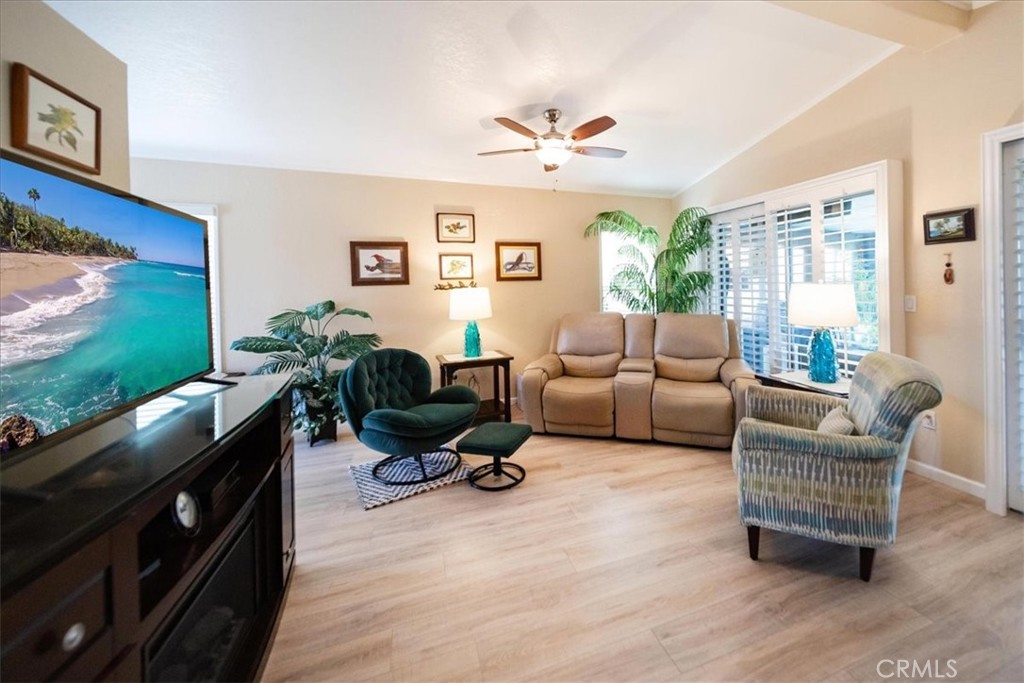 35493 Sand Rock Road Thousand Palms, CA 92276 - Photo 5 of 71 a living room with furniture flat screen tv and a large window