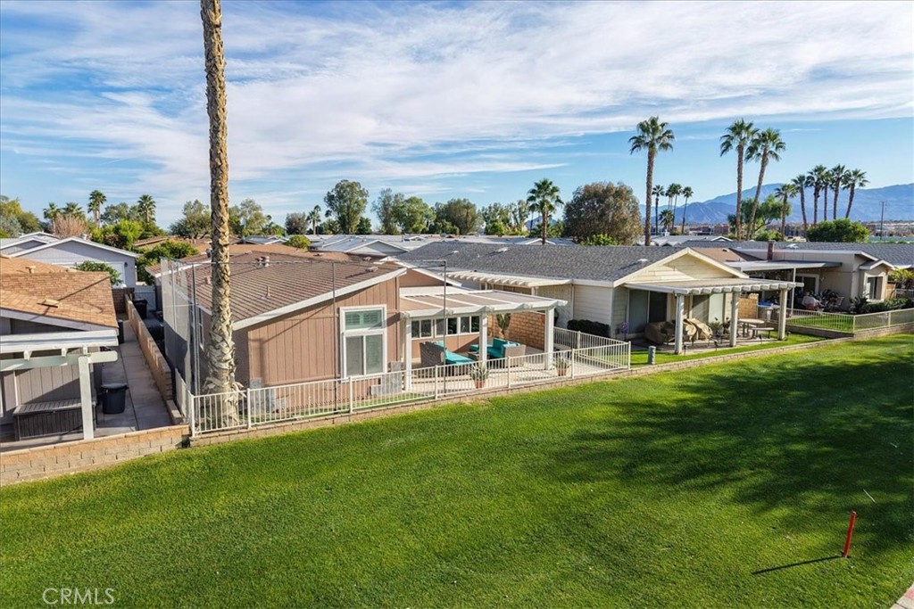 35493 Sand Rock Road Thousand Palms, CA 92276 - Photo 53 of 71 a view of a house with a big yard and large trees