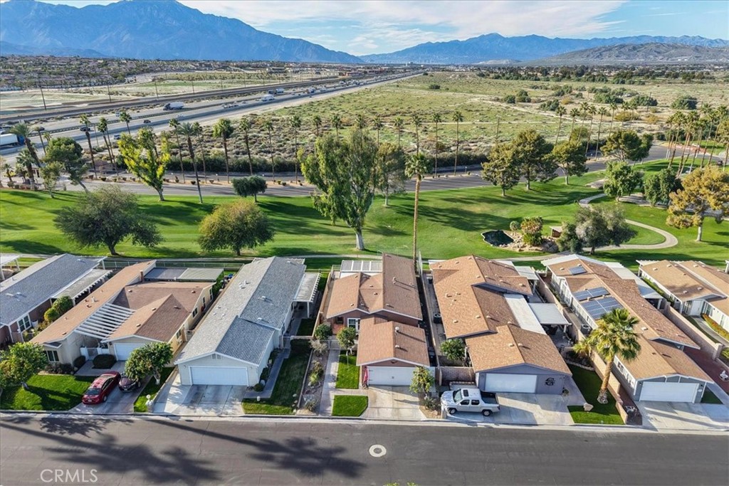 35493 Sand Rock Road Thousand Palms, CA 92276 - Photo 55 of 71 an aerial view of residential houses with outdoor space and street view