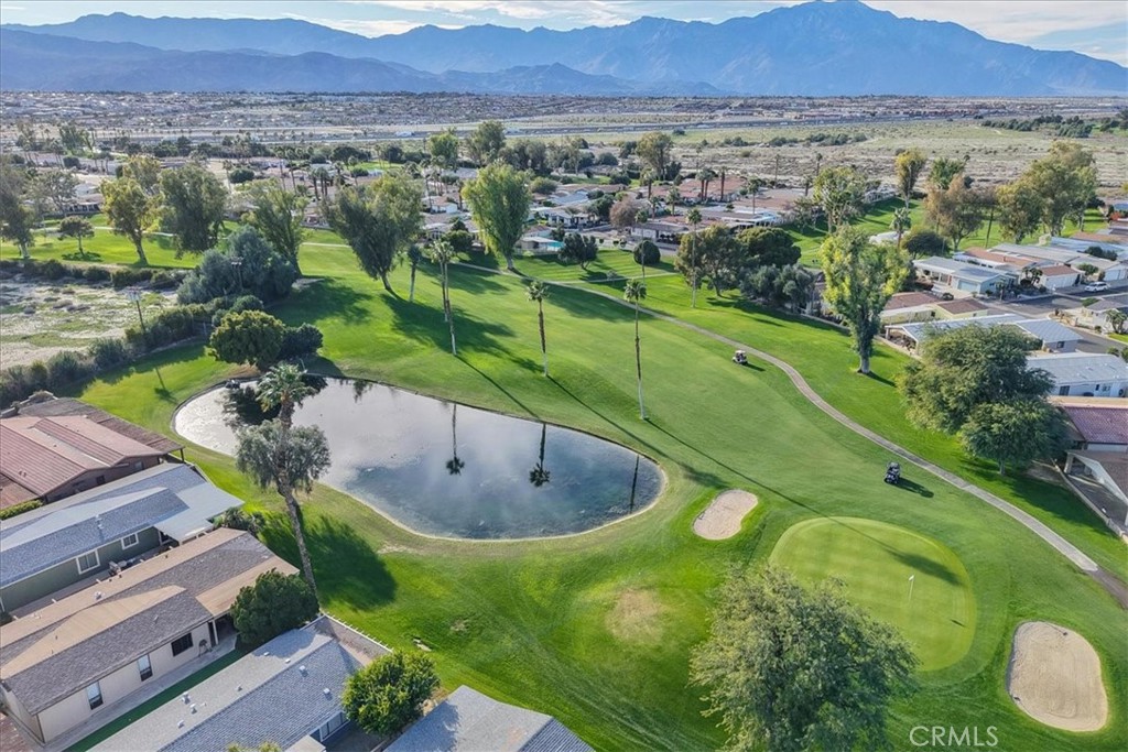 35493 Sand Rock Road Thousand Palms, CA 92276 - Photo 65 of 69 a view of a lake with a mountain in the background