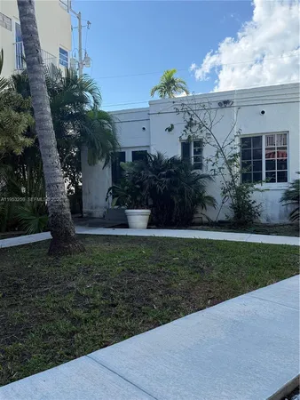 a view of a house with a garden