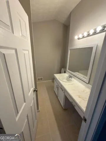 a bathroom with sink shower and bathtub