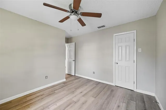a bathroom with a sink a mirror a toilet and a shower