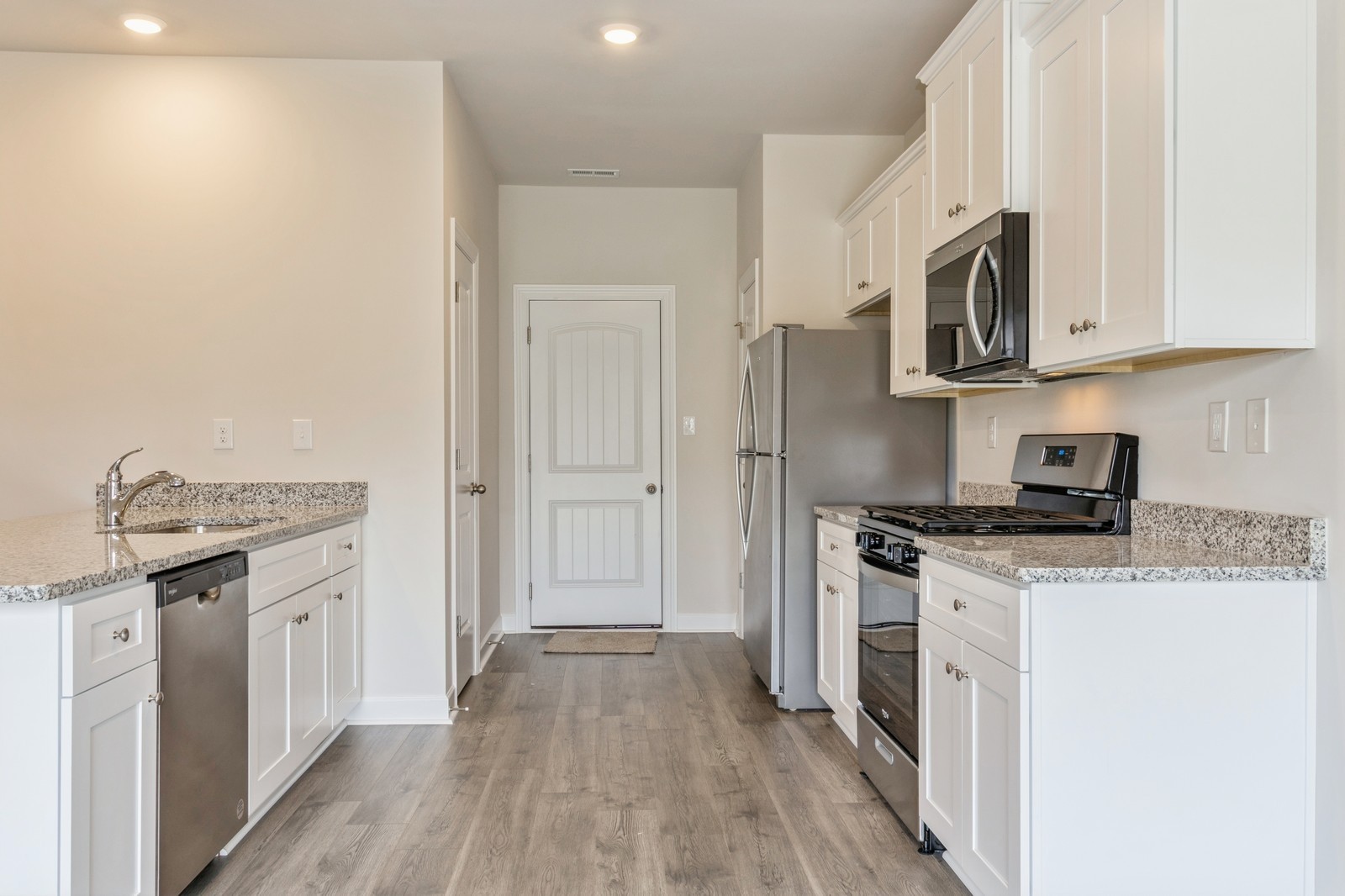 2334 Nabali Way Murfreesboro, TN 37127 - Photo 18 of 25 a kitchen with stainless steel appliances granite countertop a stove top oven a sink and a refrigerator