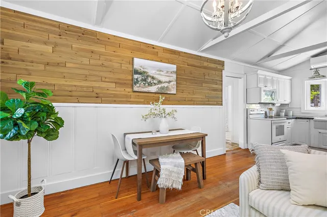 a kitchen with stainless steel appliances a refrigerator sink and cabinets