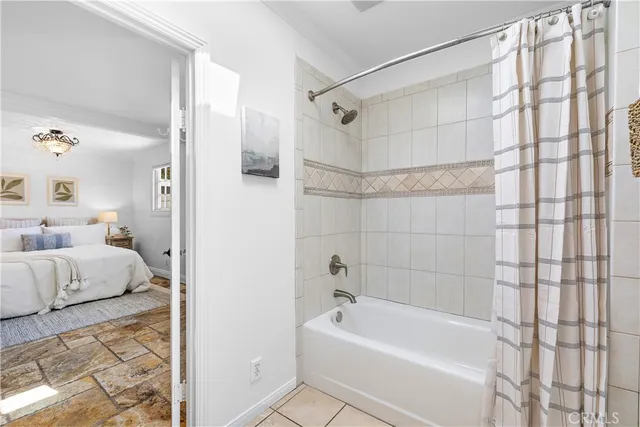 a bathroom with a sink a mirror and a window