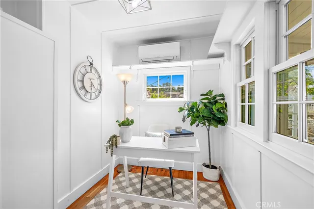 a view of a house with a tree in a yard