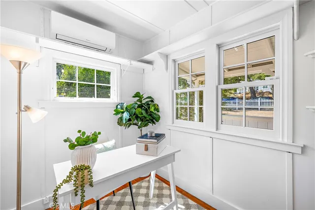 an aerial view of a house with a yard and garden