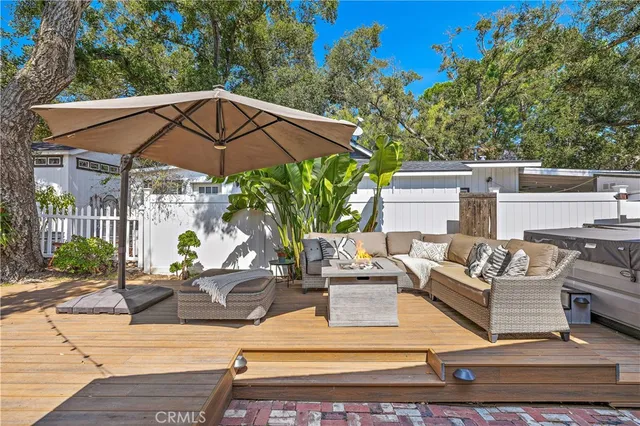 a view of a hallway with wooden floor and cabinet