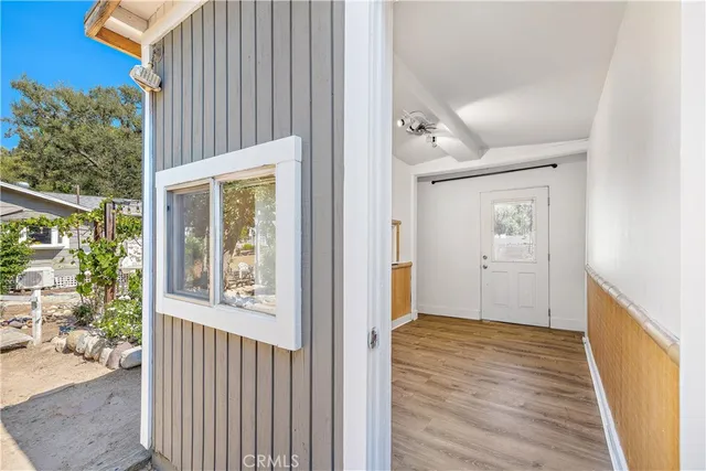 a view of a patio with a table chairs and a fire pit