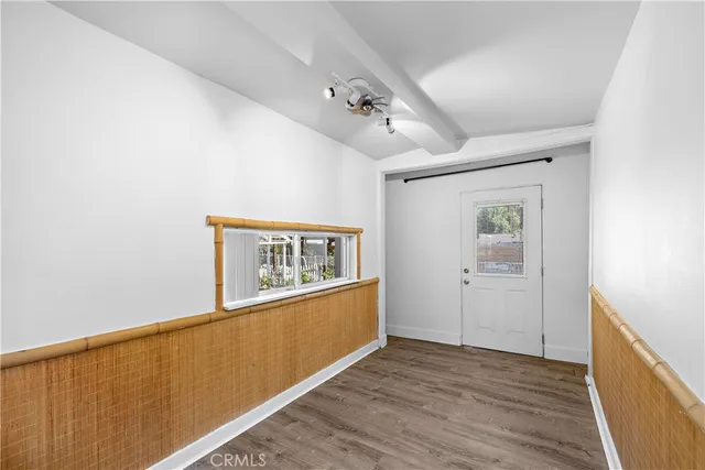 a view of a chairs and table in patio