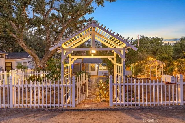 a view of outdoor space with sign board and garden