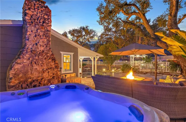 an aerial view of a house with a yard and swimming pool