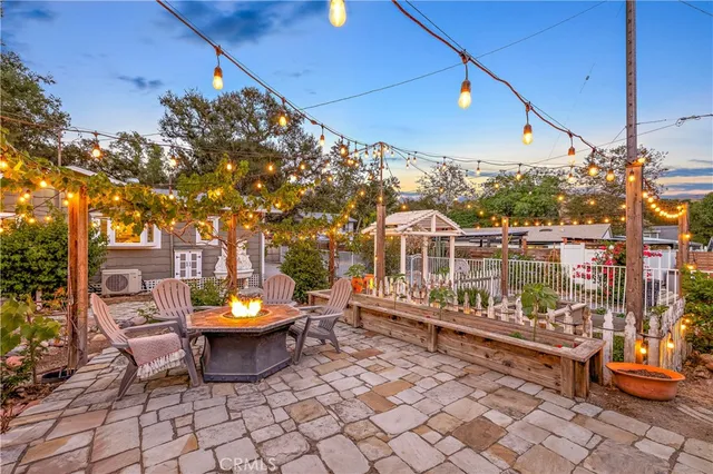 a view of a chairs and table in the patio
