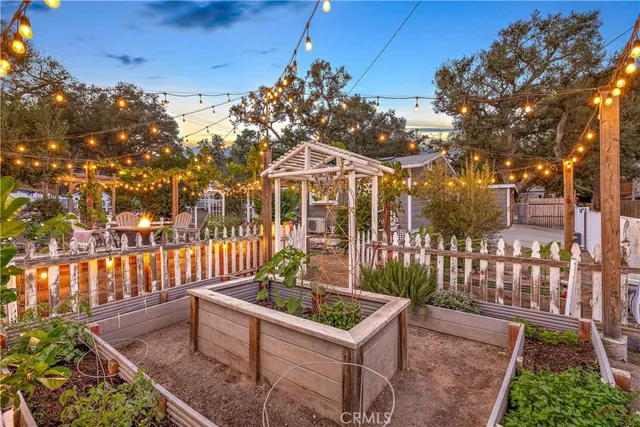 a building outdoor space with patio furniture and potted plants