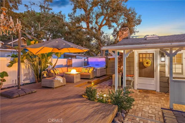 a living room with furniture fireplace and flat screen tv