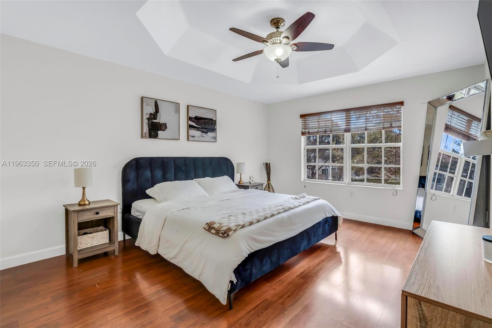 12464 Southwest 42nd Street Miramar, FL 33027 - Photo 17 of 40 a bedroom with a large bed and a window