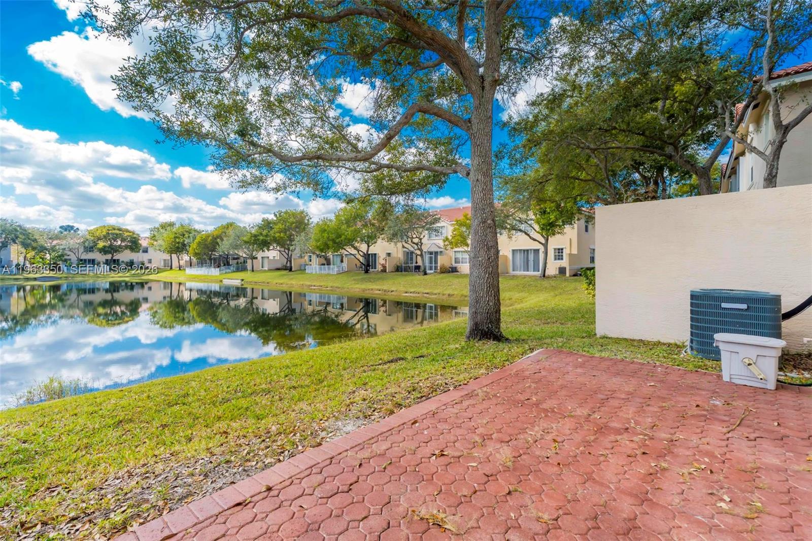 12464 Southwest 42nd Street Miramar, FL 33027 - Photo 25 of 40 a view of a lake with a big yard