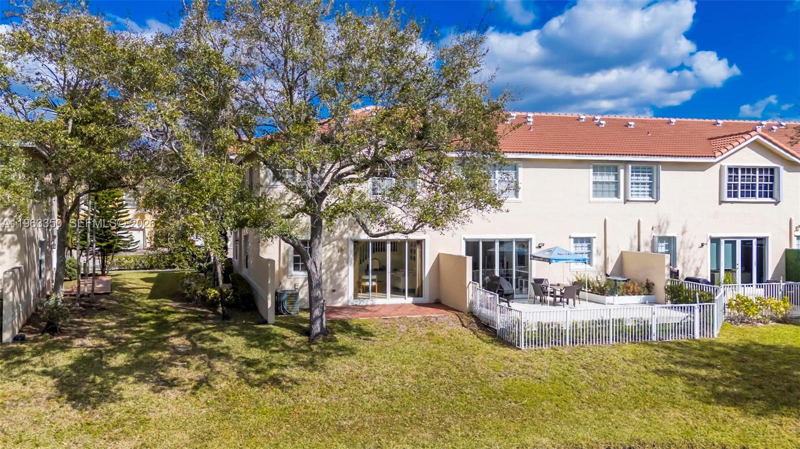 12464 Southwest 42nd Street Miramar, FL 33027 - Photo 30 of 40 a view of a house with a yard
