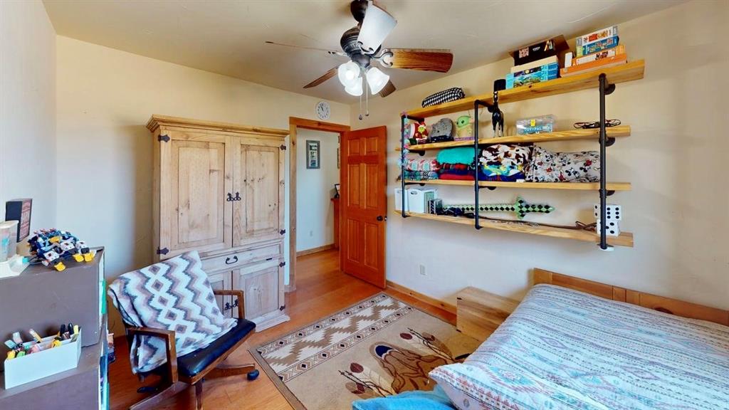 19319 Ranch Road 1871 Mason, TX 76856 - Photo 11 of 40 a bedroom with furniture and a couch