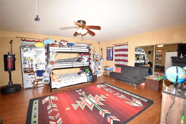 a living room with furniture pool and flat screen tv