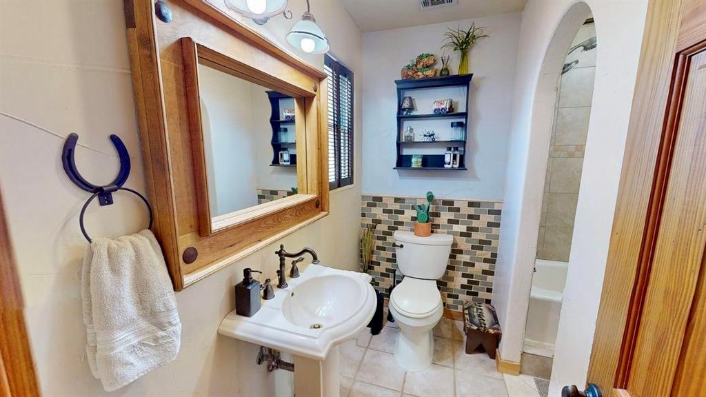 19319 Ranch Road 1871 Mason, TX 76856 - Photo 14 of 40 a bathroom with a sink and a mirror