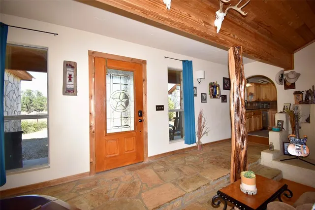 a view of livingroom with furniture and window
