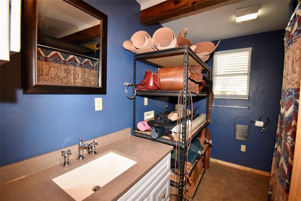 19319 Ranch Road 1871 Mason, TX 76856 - Photo 24 of 40 a bathroom with a sink and a mirror