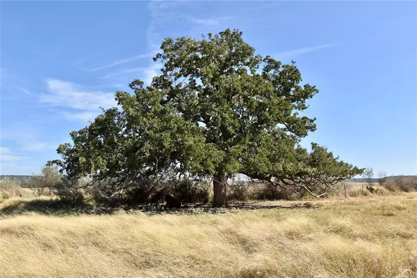 a view of a balcony with lake view and a floor to ceiling window